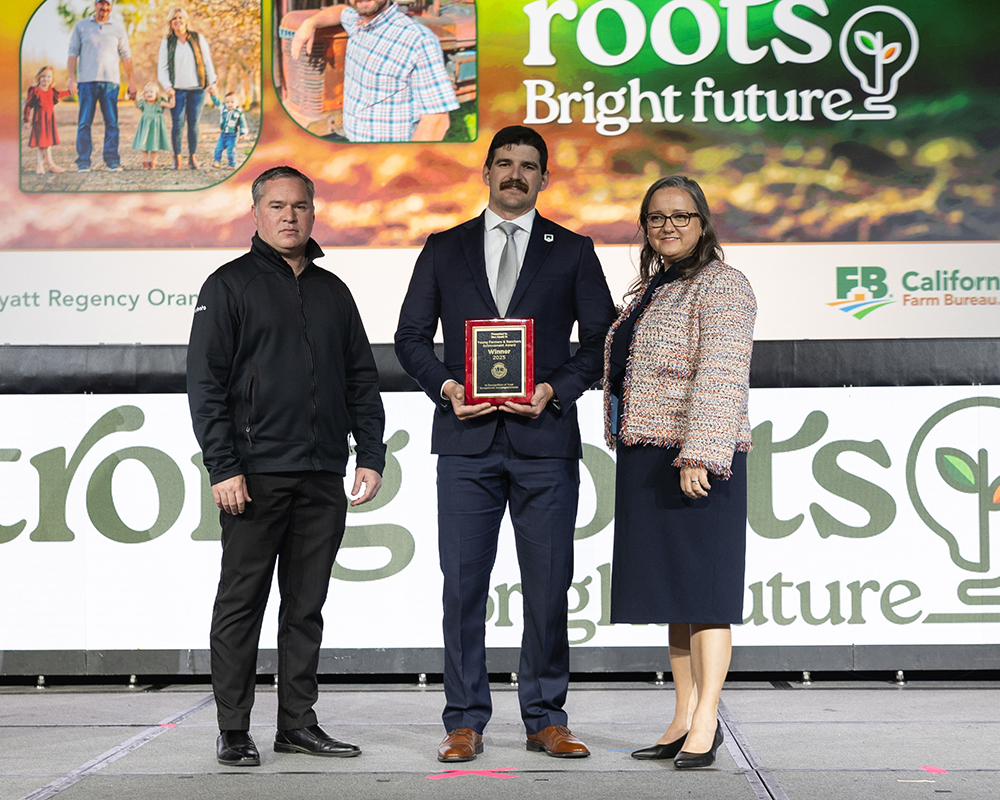 Ben Abatti, center, receives the YF&R Achievement Award from Blake Barnes of Kubota Tractor, left, and California Farm Bureau President Shannon Douglass.