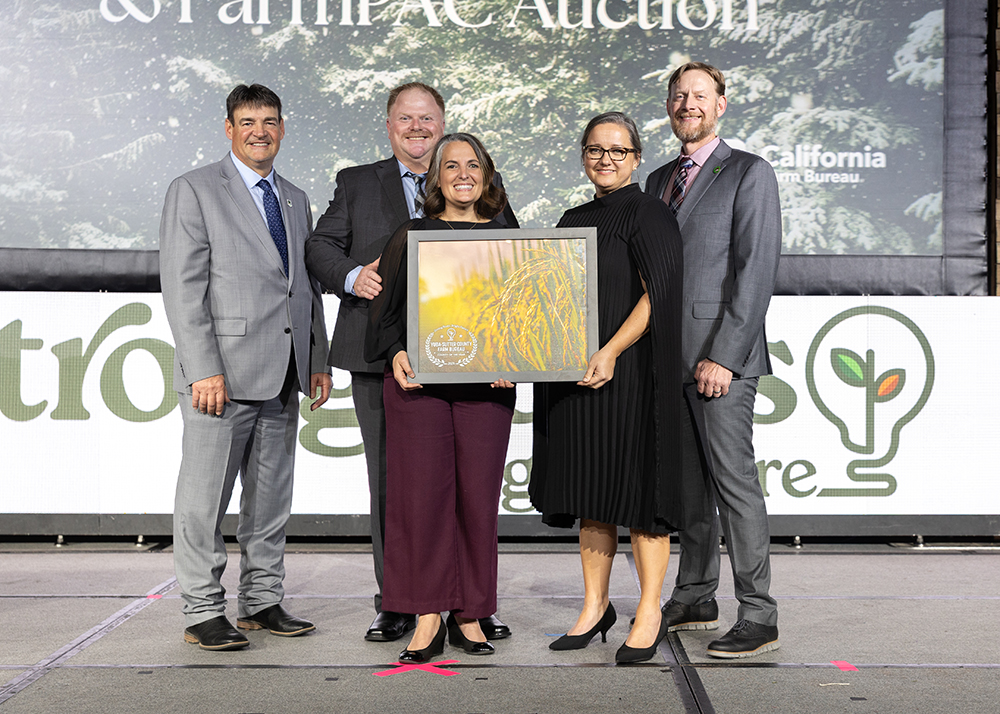 Brian Greathouse, second from left, and Stephanie Younger, center, accept the County of the Year Award on behalf of Yuba-Sutter Farm Bureau from Ron Peterson, left, Shannon Douglass and Shaun Crook.