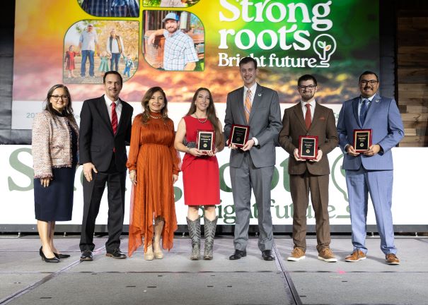 California Farm Bureau President Shannon Douglass, left, and Jim and Normita Spinetta congratulate the YF&R Discussion Meet Award finalists, from left, first runner-up Jynel Gularte, winner J.P. Beall, Brendan Black and John Tamayo.
