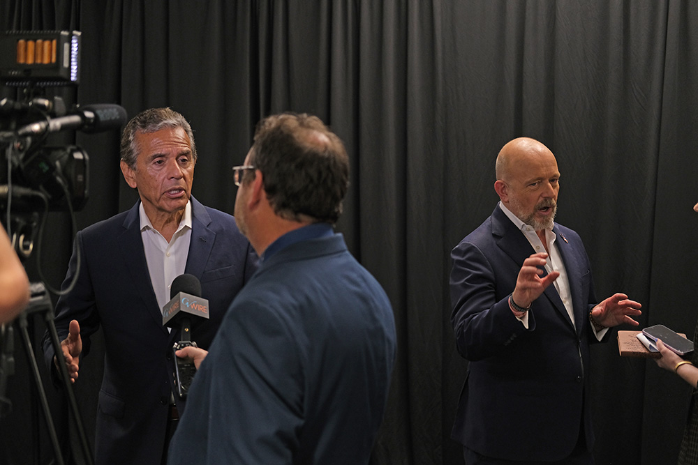Former Los Angeles mayor Antonio Villaraigosa, left, a Democrat, and former conservative commentator Steve Hilton, a Republican, speak with reporters last week at Fresno State University. 