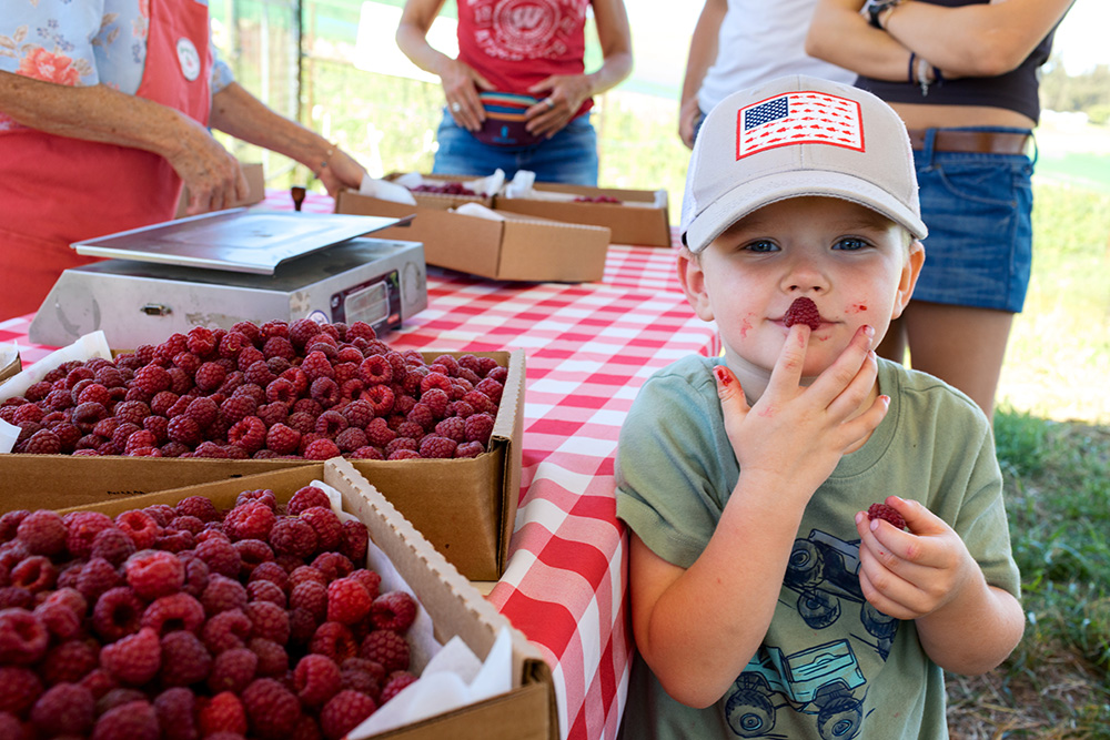 Farmer Rachel Boring says she enjoys seeing children whose faces are red from eating her berries.