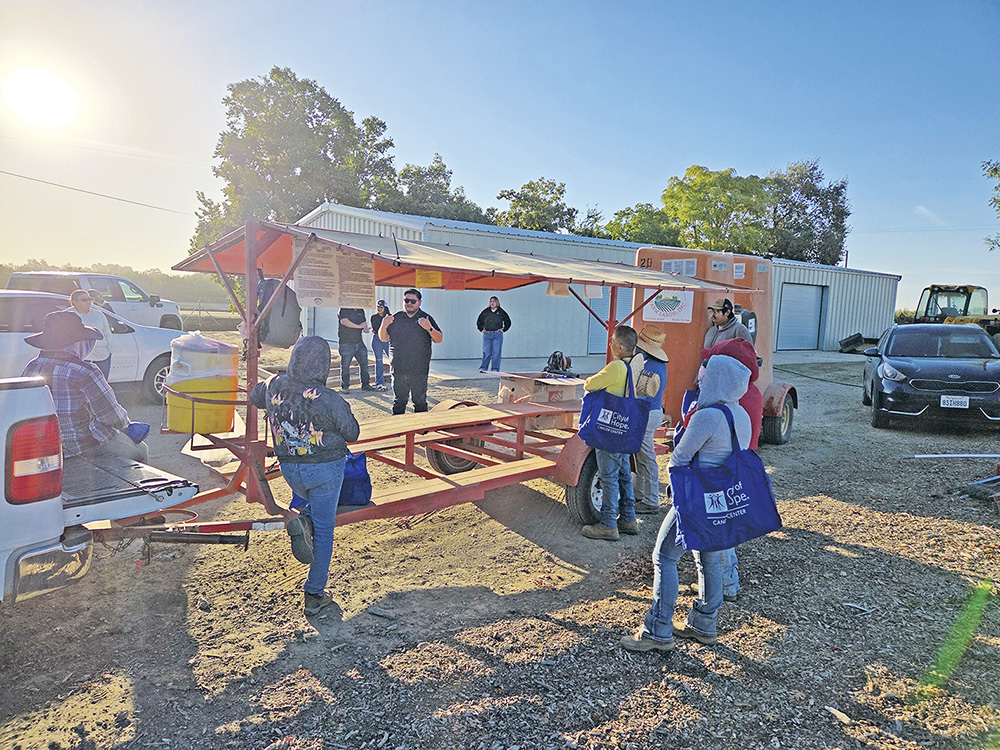 In addition to passing out the kits, Parra speaks to farmworkers about how to prevent heat illness in the field as part of the face-to-face training.
